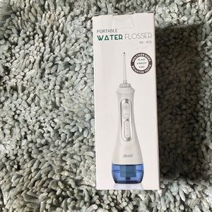 Portable water flosser